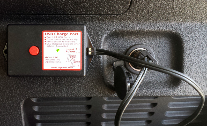 USB Charge Port plugged into the rear of a Ford Flex